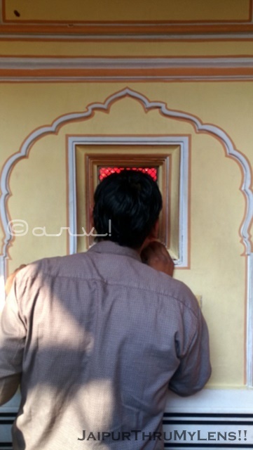 raj-rajeshwar-mandir-city-palace-jaipur-man-looking-window